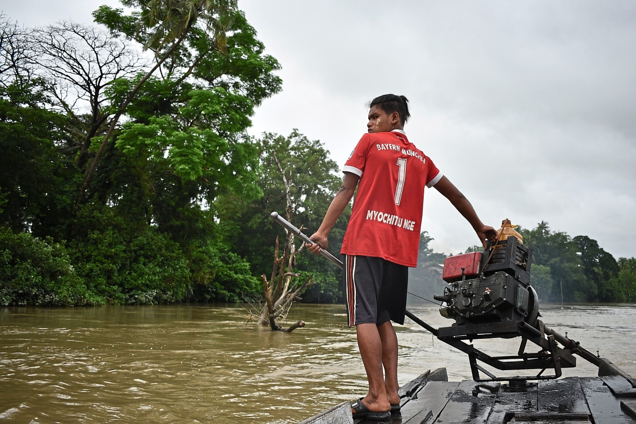 A young ferryman on the Attaran. Better roads have made Mawlamyine a city that many young people leave for better opportunities. — Photos by Team Ceritalah