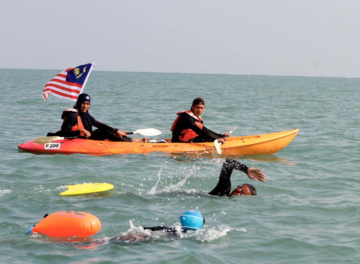 Kids with autism, dyslexia complete 10km swim across Selat Dinding for