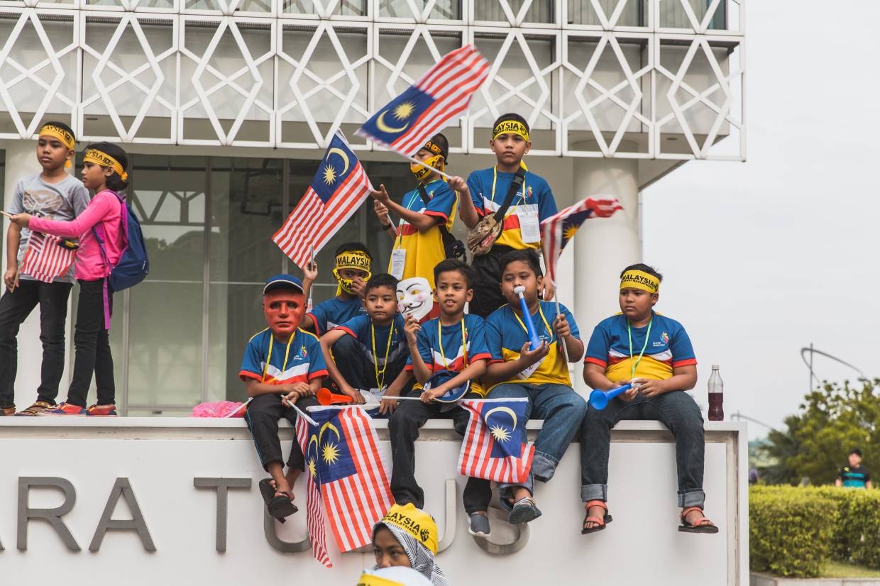 Birthday month celebration: Like for many of its neighbours, August was a time for singing patriotic songs and waving the national flag for Malaysia. - Photos by Team Ceritalah