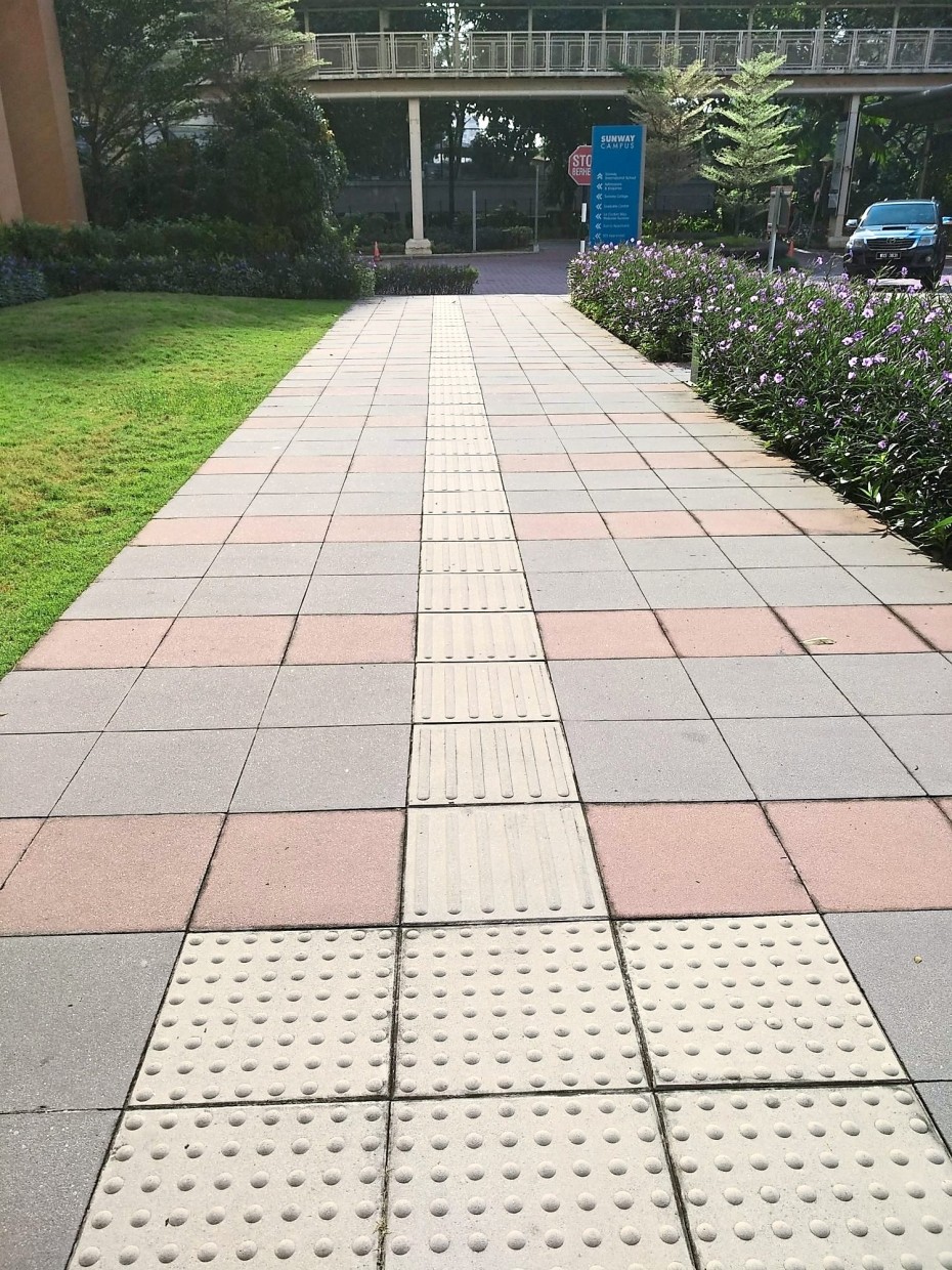 There is tactile paving on walkways and sidewalks throughout Sunway University.