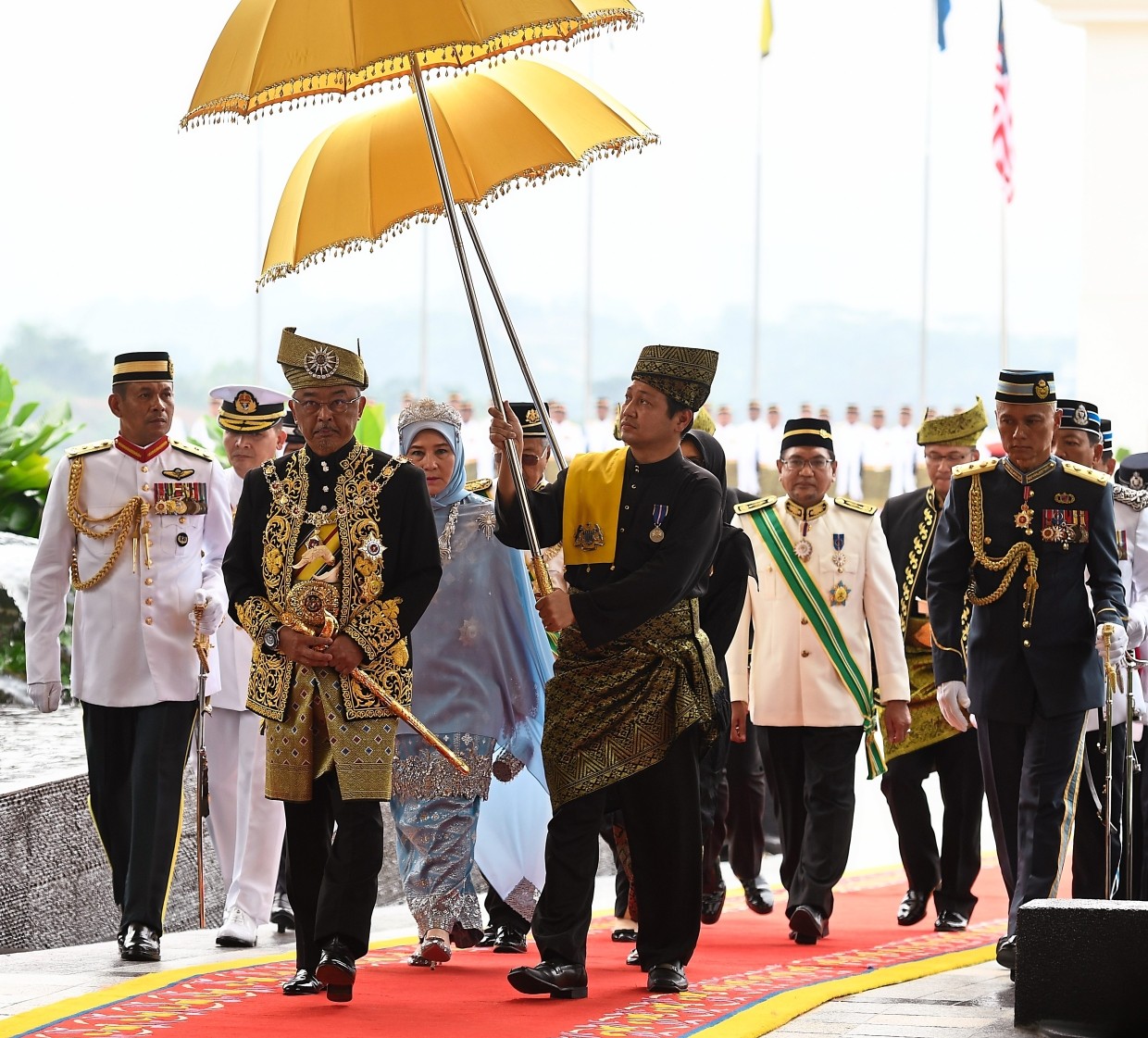 Royal arrival: Sultan Abdullah walking with Raja Permaisuri Tunku Hajah Azizah at Istana Negara in Kuala Lumpur. — Bernama