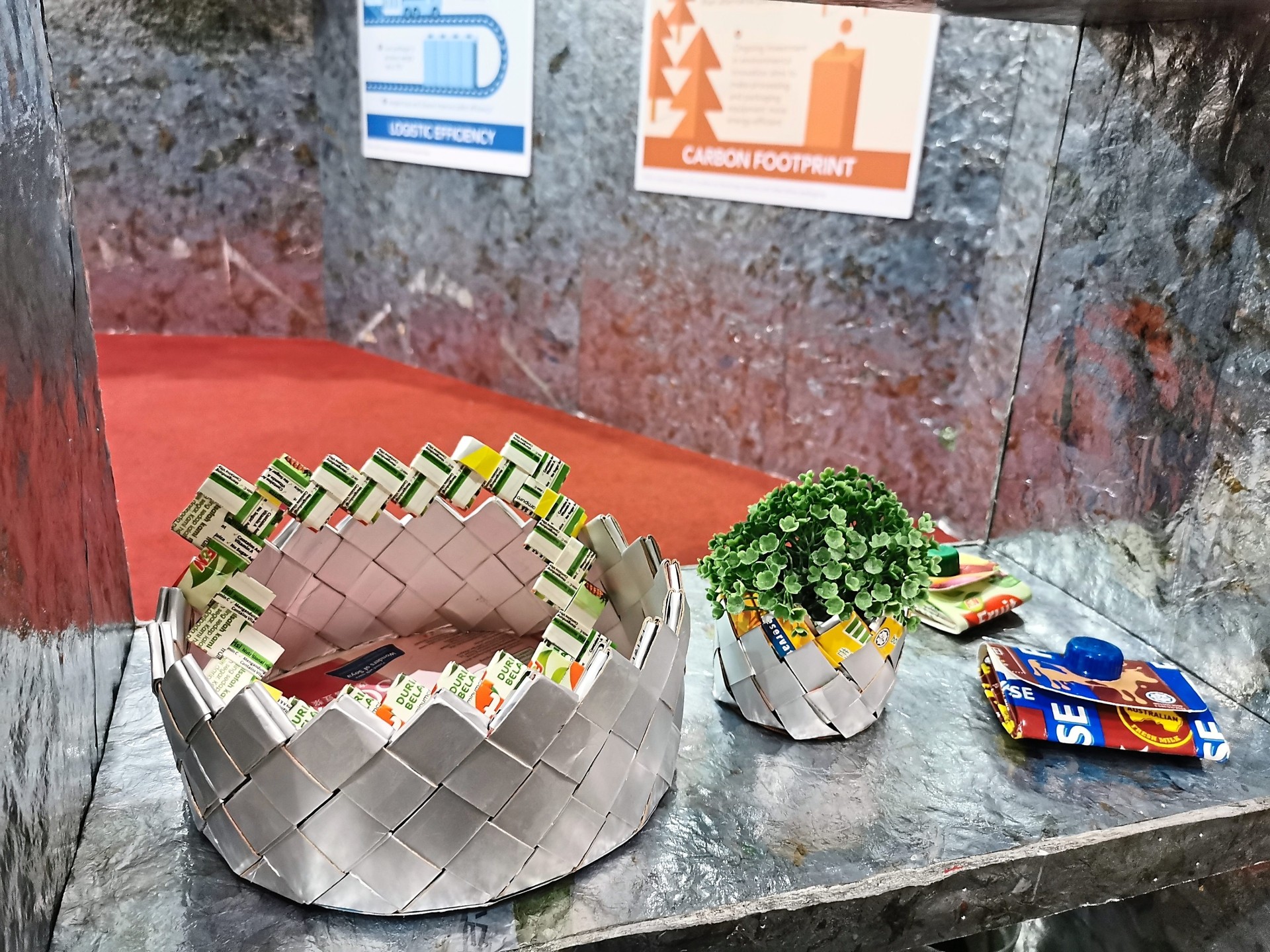 Examples of upcycling — flower basket made from reusing waste paper and beverage carton.