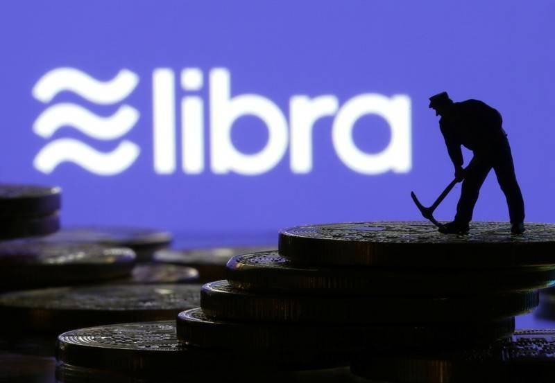 A small toy figure stands on representations of virtual currency in front of the Libra logo in this illustration picture June 21 2019. REUTERSDado RuvicIllustration