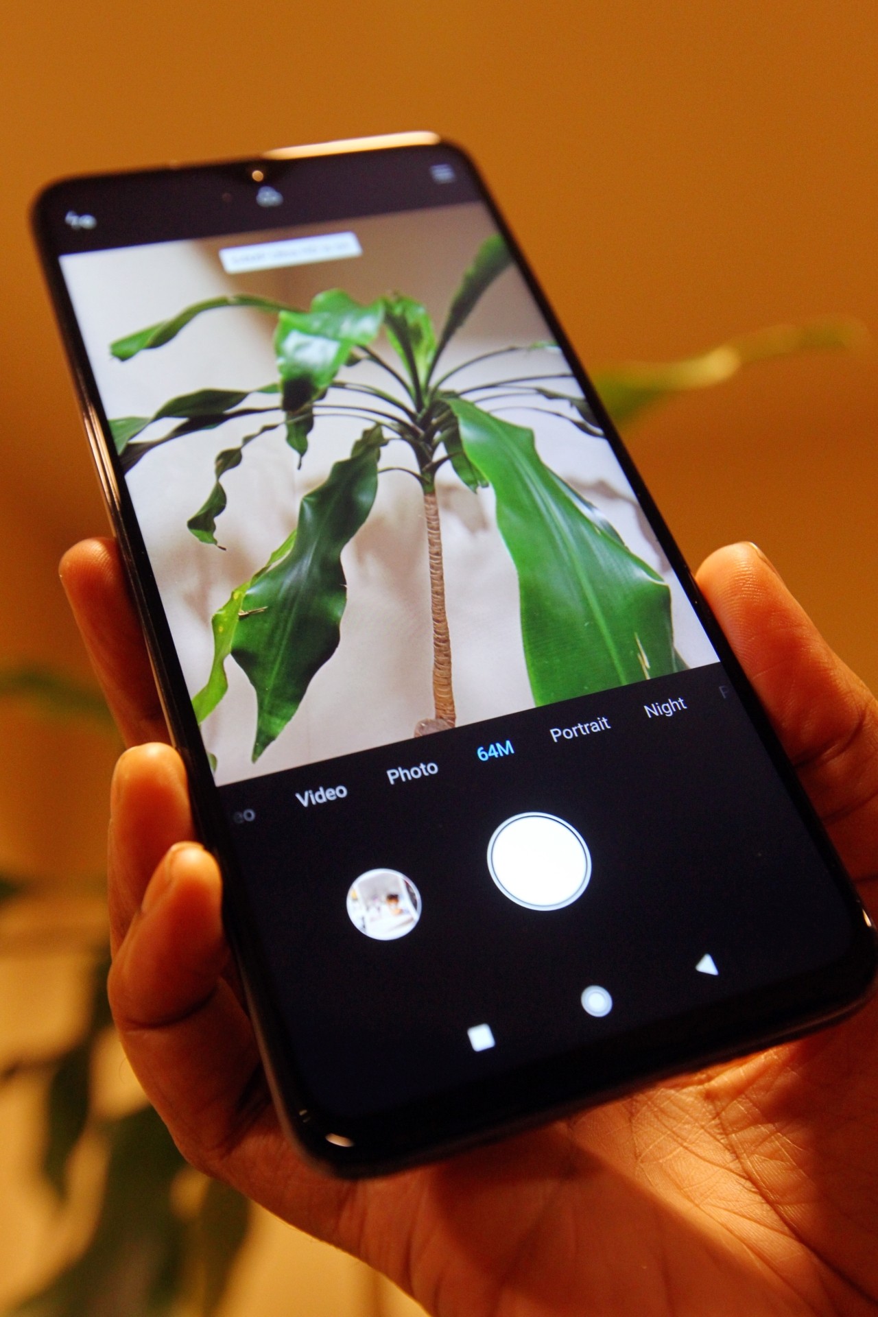 You have to manually choose the 64-megapixel mode when you launch the camera app.