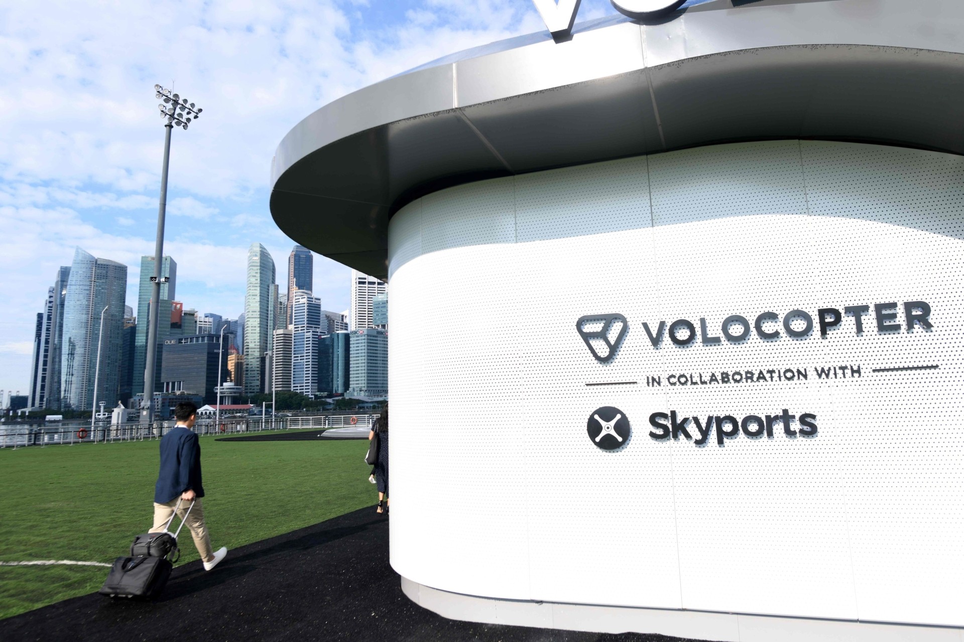 Visitors walking towards the prototype VoloPort in Marina Bay.