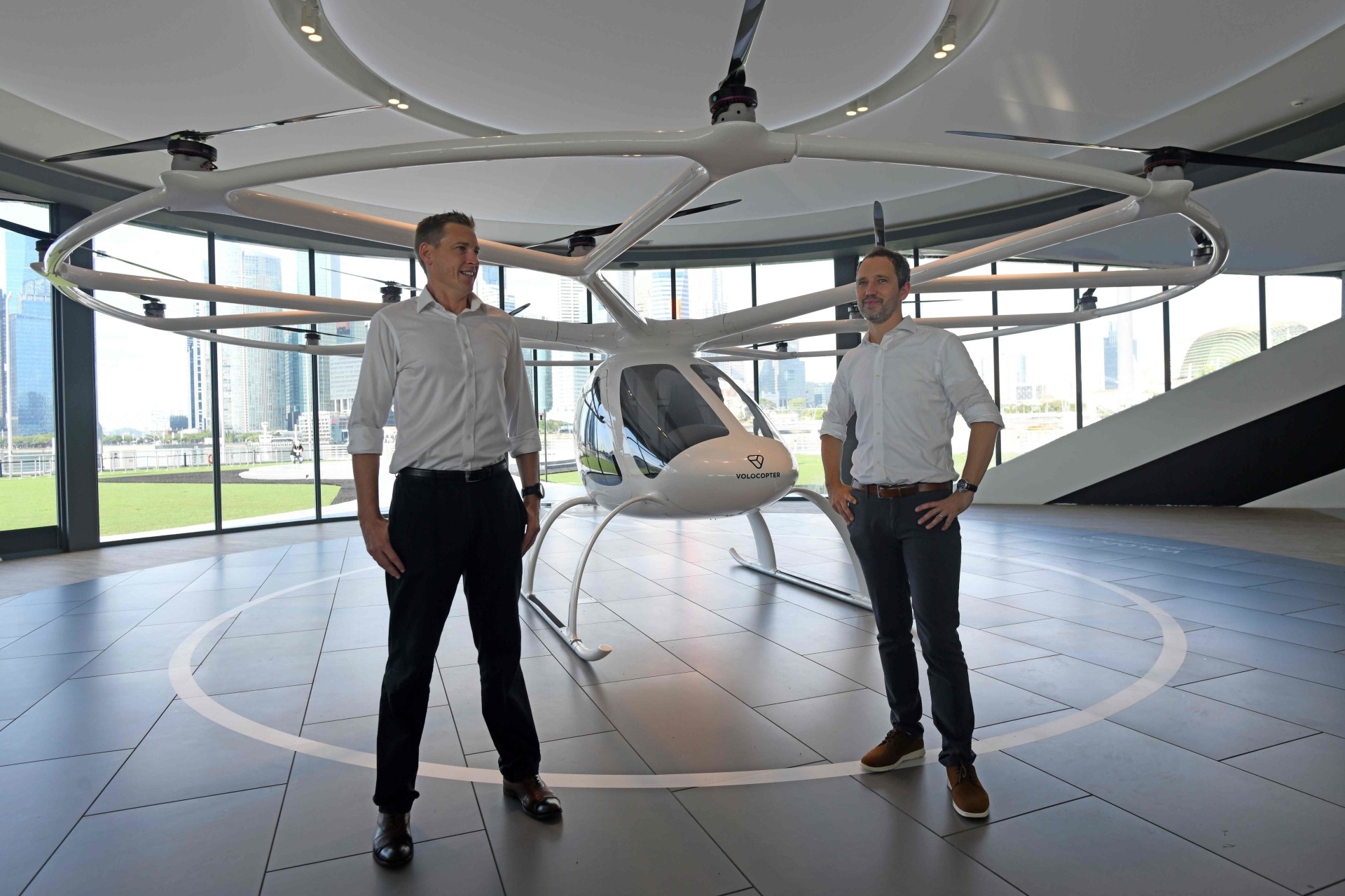 Reuter (right) and Walker in front of the Volocopter unmanned air taxi transport.
