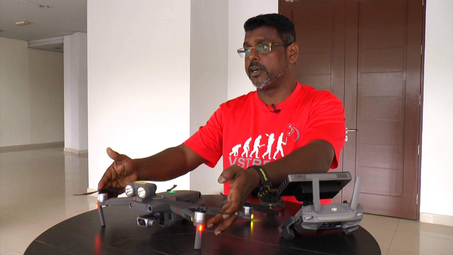 VStream Revolution’s L. Saravanan shows a drone that the company uses for surveillance and security.