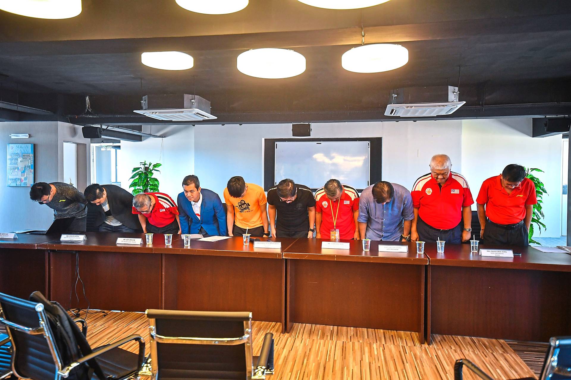 Deeply regretful: Maba officials bowing in apology during a press conference at the Maba Stadium in Kuala Lumpur.