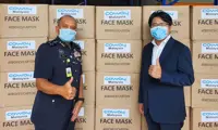 Coway Malaysia donates thousands of protective face masks to PDRM