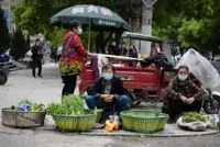 Chinese city eases virus lockdown but life is far from normal