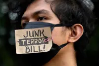 Philippine anti-terror bill in Duterte hands as calls for veto mount