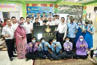 Businessman who grew up poor back to support his school