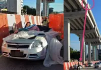 Woman's lucky escape after large piece of concrete falls on her car