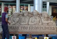 Frontliners saluted with sand sculpture