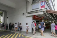 Singapore sees long queues to buy tickets for S$5mil jackpot prize