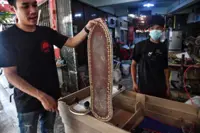 Thai coffin-maker kickflips his caskets into skateboards