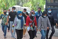 Six workers charged with using fake MC