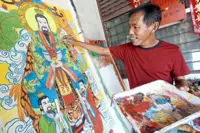 Carrying on the art of painting deities