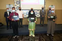 Laptops and food coupons to undergrads from poor families