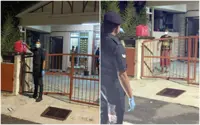 Sepang police bring food to 14 people in house under quarantine