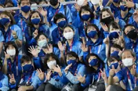 Pensioners defy virus fears, volunteer to keep Tokyo Olympics running