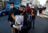 Argentines stream through city streets to press for more jobs, food