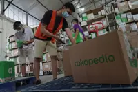 Grab raises stake in Indonesia’s Ovo to 90%, buys out Tokopedia
