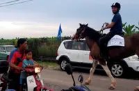 Melaka Polls: Independent candidate mounts a horse while campaigning in Serkam