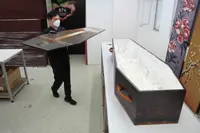Hong Kong turns to more eco-friendly cardboard coffins as Covid death toll rises