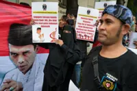 Supporters of controversial Indonesian preacher denied entry to Singapore stage protests in Jakarta, Medan