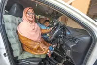 Disabled teacher helps special needs students achieve success in Kota Baru