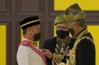 King confers Datukship on badminton great Foo Kok Keong