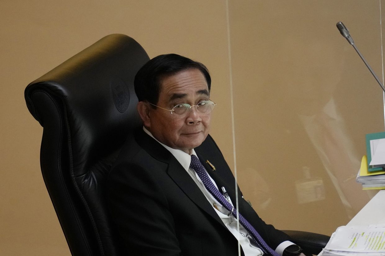 Thailand Prime Minister Prayut Chan-O-Cha attends a no-confidence debate at the Parliament in Bangkok, Thailand, Tuesday, July 19, 2022. Thailand's opposition parties on Tuesday began a no-confidence debate targeting Prayuth and ten of his Cabinet members, who face accusations of corruption and economic mismanagement.  - AP