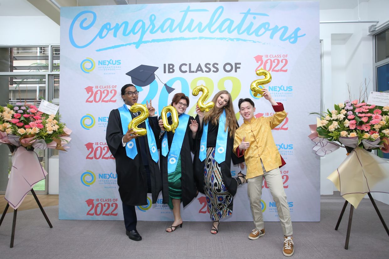 Chung (yellow shirt) graduated with his IB classmates, winning the Karen McKellin International Leader of Tomorrow award from the University of British Columbia.