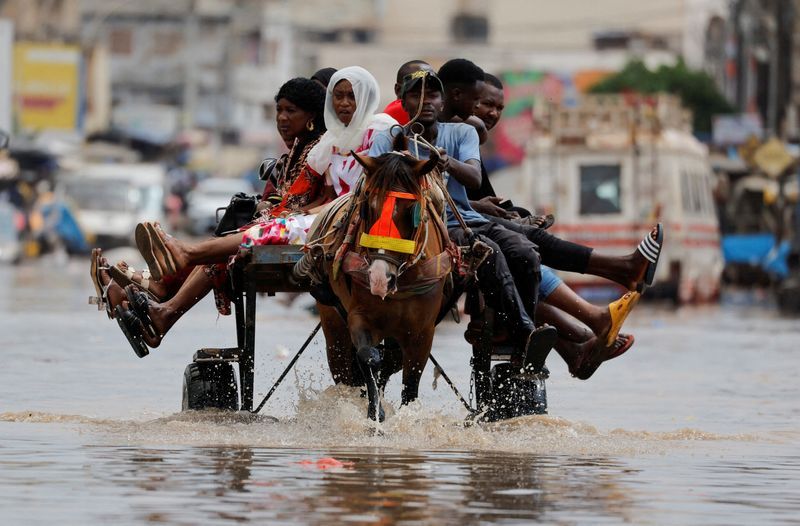 Senegal capital wades through floodwater after heavy rain - Vimarsana News