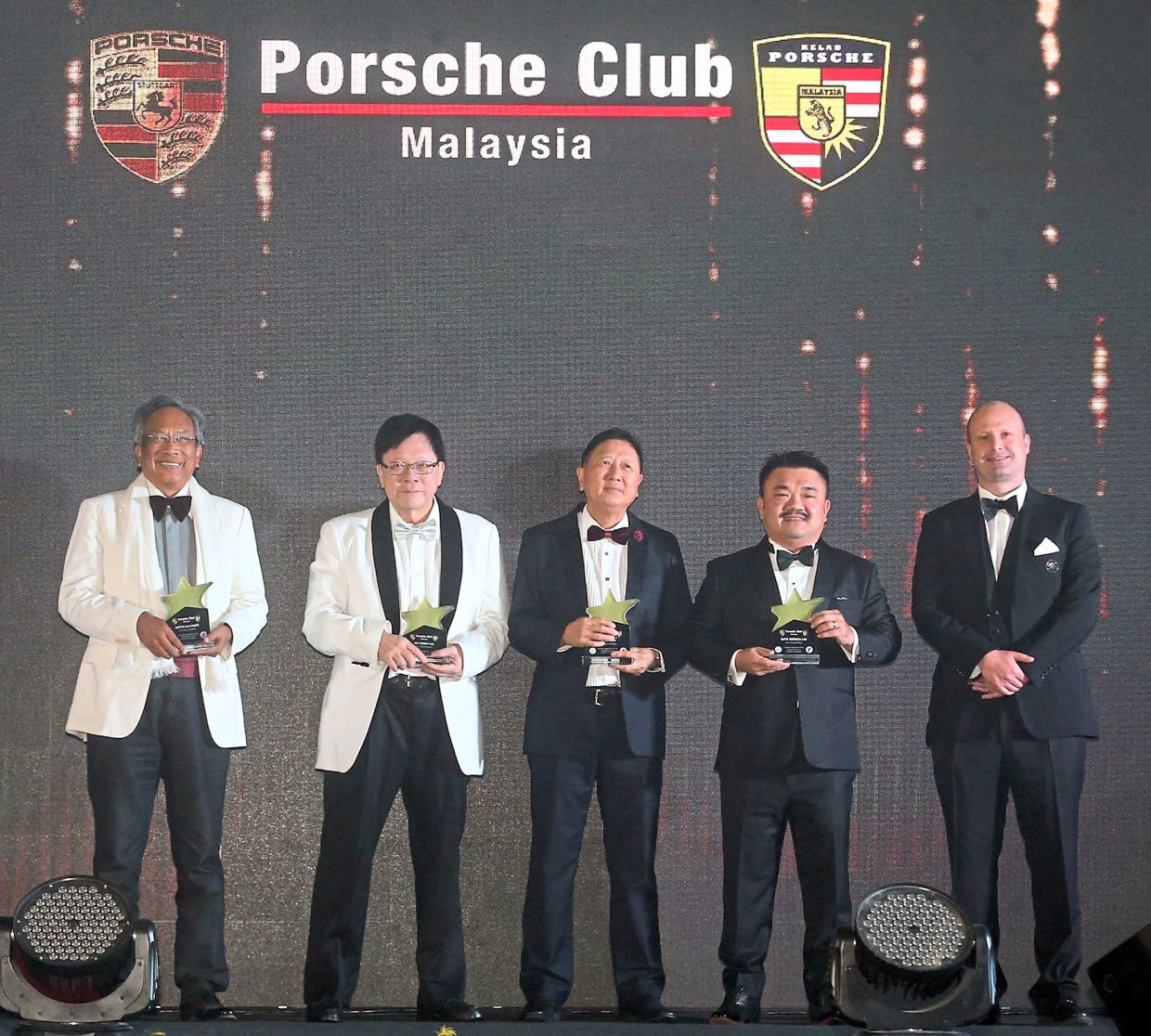 (From left) Former Porsche Club Malaysia president Datuk Ali Kadir, PCM advisor Key Soon Yue, PCM deputy president Jason Low, PCM president Datuk Derrick Lim and Sime Darby Auto Performance CEO Christopher Hunter looking dapper on stage.