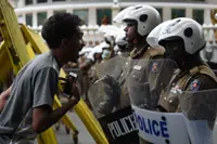 Sri Lanka troops demolish main protest camp; commandos wielding weapons charge at protesters