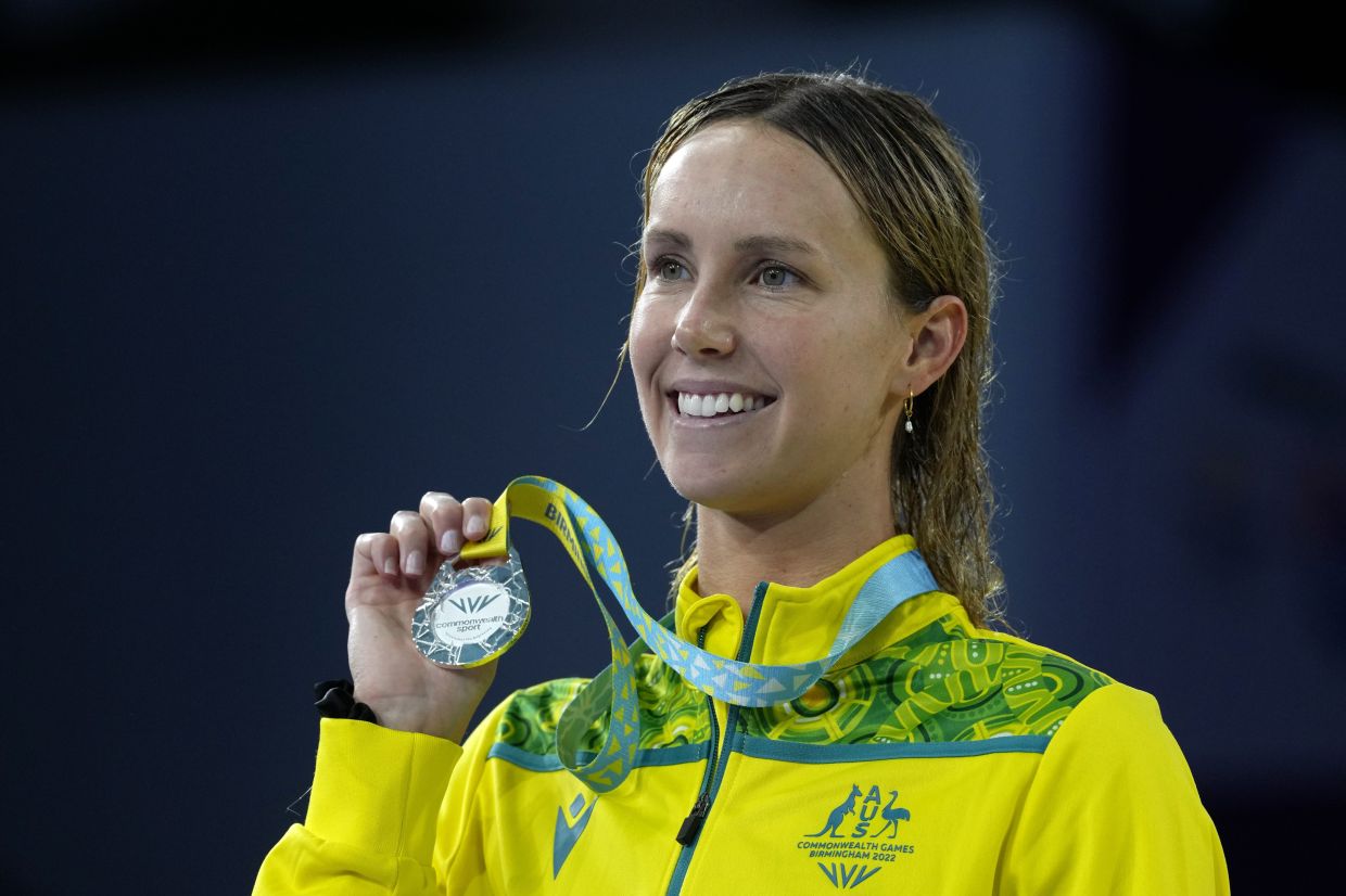 Emma McKeon of Australia poses after winning the silver medal in the Women's 100 metres butterfly final during the Commonwealth Games at the Sandwell Aquatics Centre in Birmingham, England, Saturday, July 30, 2022. - AP
