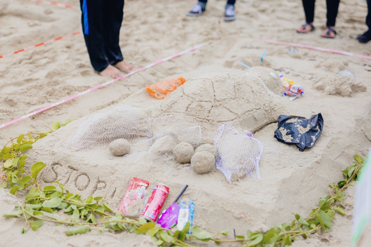 A sand sculpture with a strong environmental message.