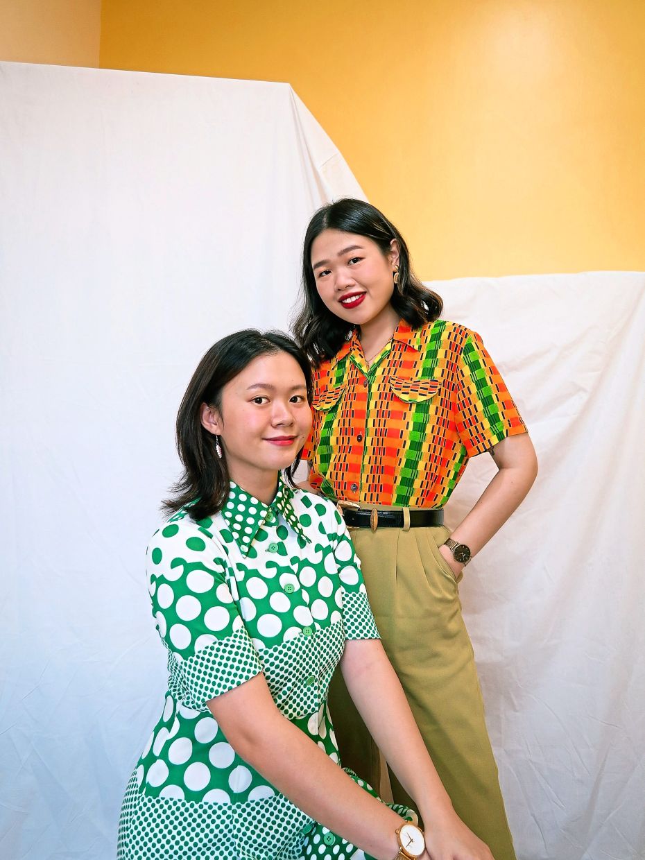 Pre-loved clothing ranges from vintage apparel to denim pieces. Pictured here is Cindy Lai (seated) and Serene Lai, who run an online vintage store. Photo: Astlyr & Blythe