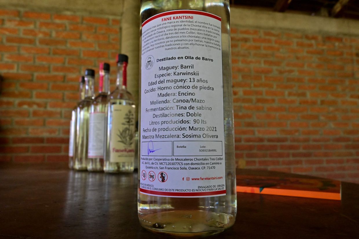 Picture of bottles of mezcal taken at the mezcal factory Tres Colibries (Three Hummingbirds) in Villa Sola de Vega, Oaxaca State, Mexico. – Photo: AFP