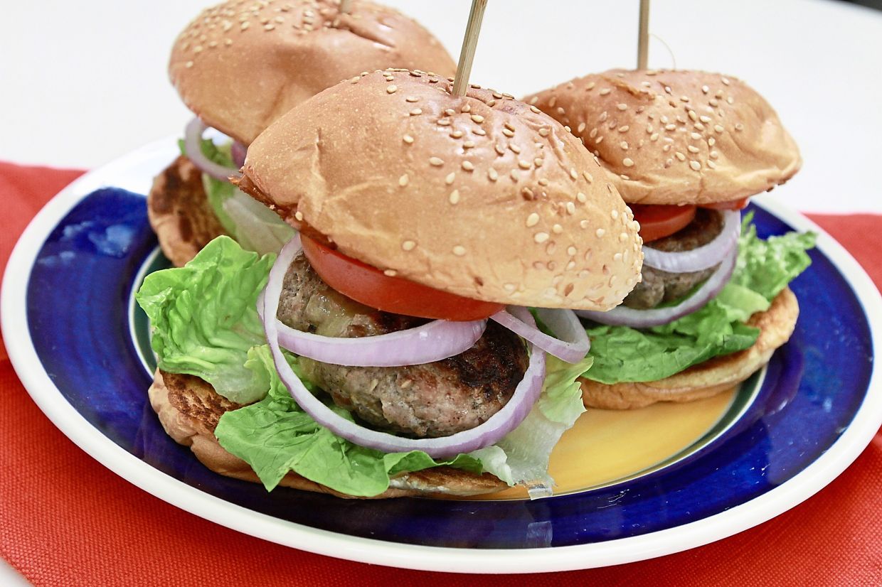 Juicy Lucy is a burger with cheese stuffed inside the patty to create a moist and juicy burger. — Photos: LOW LAY PHON/The Star