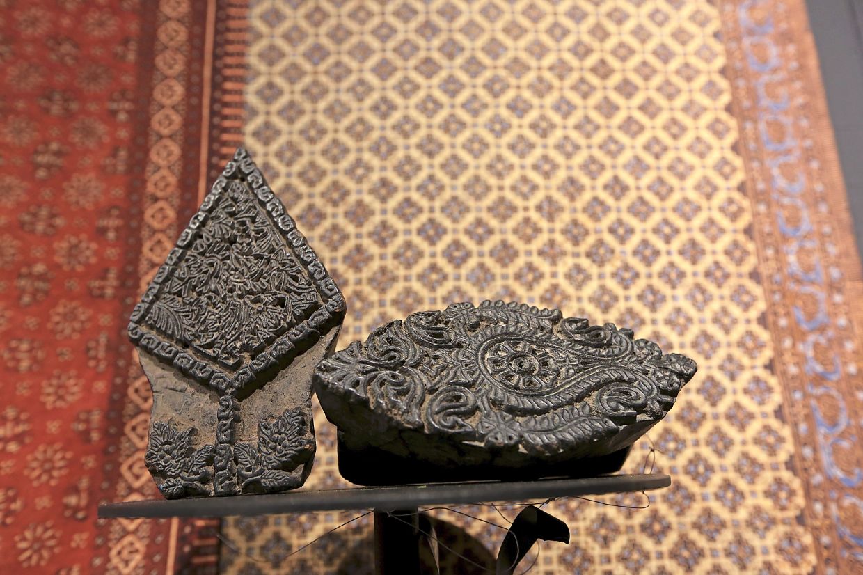 Wooden printing blocks for woodblock printing on display at the exhibit. Photo: The Star/Yap Chee Hong