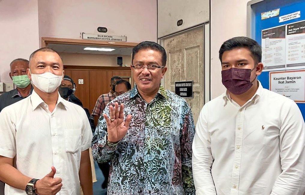 Free men: Abd Latif (middle), Ahmad Fauzan (right) and Amir Shariffuddin were acquitted of all their charges.