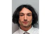 Actor Ezra Miller charged with burglary for stealing 'several bottles of alcohol'
