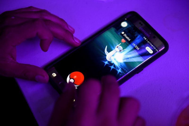 FILE PHOTO People play quotPokemon GOquot on the Pokequan GoBoat Adventure Cruise in the Occoquan River in the small town of Occoquan Virginia U.S. August 14 2016. REUTERSSait Serkan Gurbuz