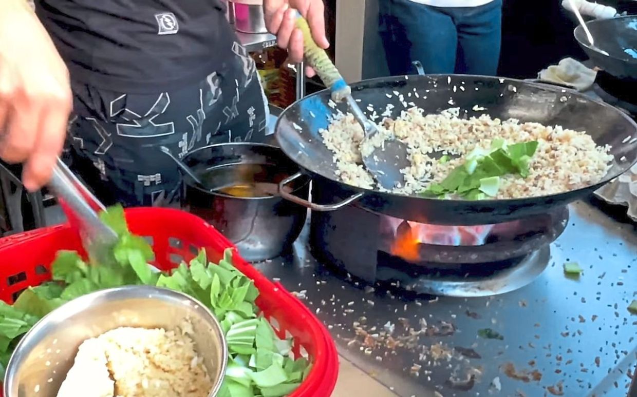 The preparation of fried rice using a family recipe. (Photo courtesy of Uncle Soon Fried Rice). 