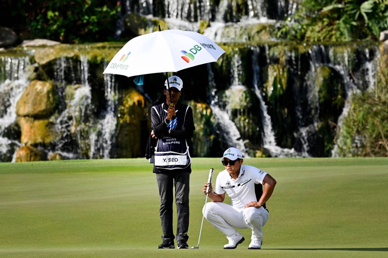 Yoseop Seo of South Korea preparing to play a shot during the International Series Singapore golf tournament at Tanah Merah Country Club in Singapore.  - AFP