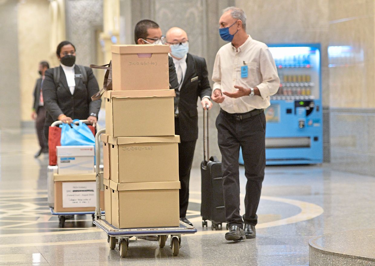 Important papers: Piles of documents being wheeled into the Palace of Justice in Putrajaya for Najib’s SRC case appeal hearing. — RAJA FAISAL HISHAN/The Star