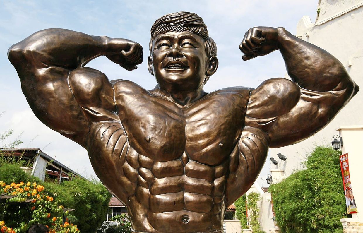 Farewell to a strongman: Metal sculpture of Mr Asia 1956 Datuk Wira Gan Boon Leong (below).